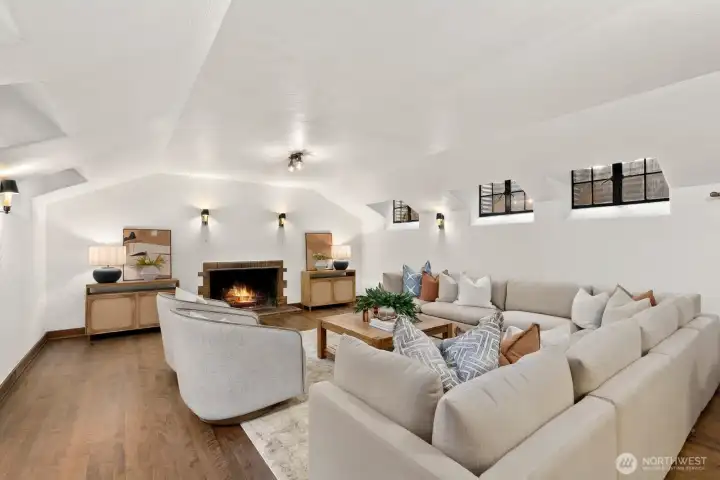 Lower level Family Room with Tudor fireplace.