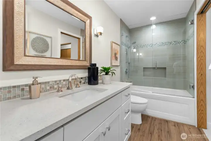 Fully updated bath with all new floors, vanity, tile, paint and more!