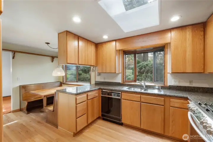 Kitchen with custom built table and seating.