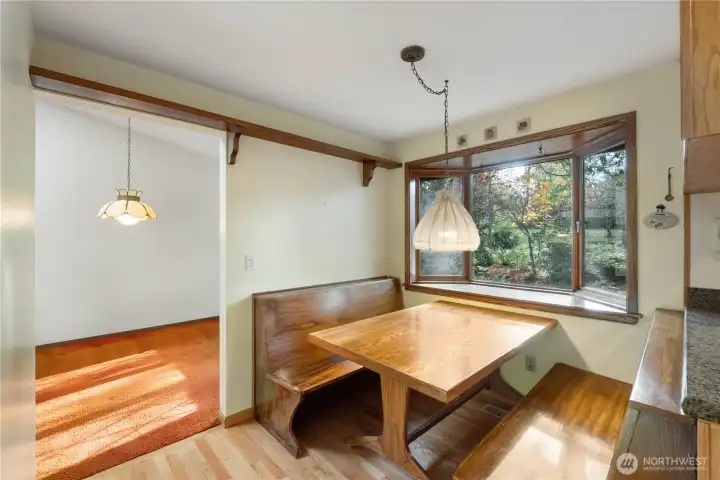 View of eat-in dining area with partial view of formal dining room.