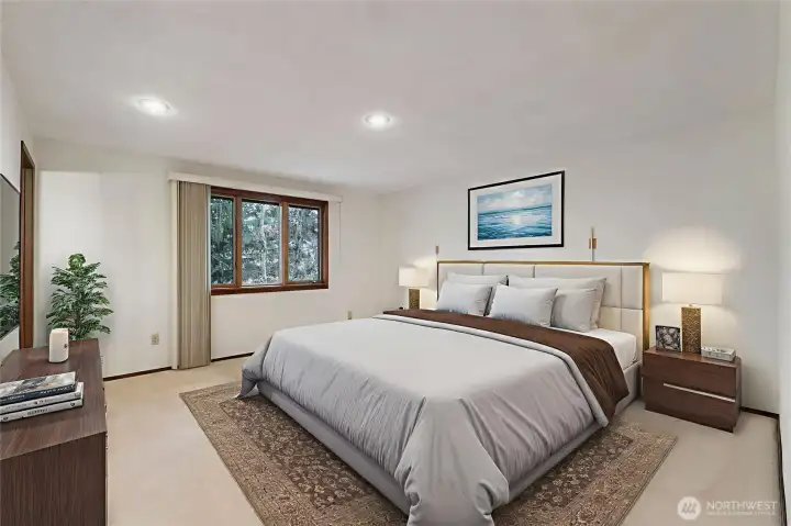 Virtually staged primary bedroom with 3/4 bath ensuite