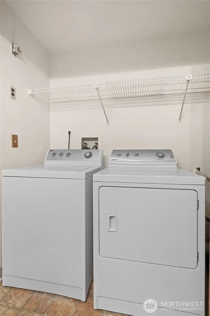 Washer and dryer is next to the new hot water tank