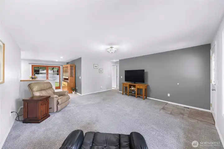 Looking from living to hallway leading to bedrooms and bath. Kitchen and dining to the left