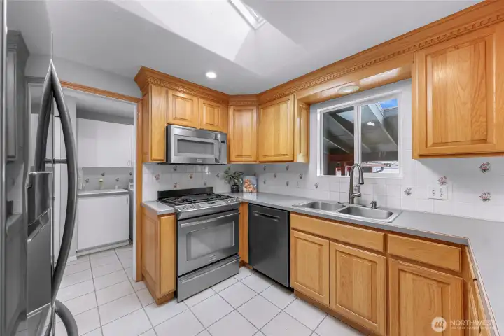 Through the kitchen you have access to your full service utility room and additional access to your backyard and patio