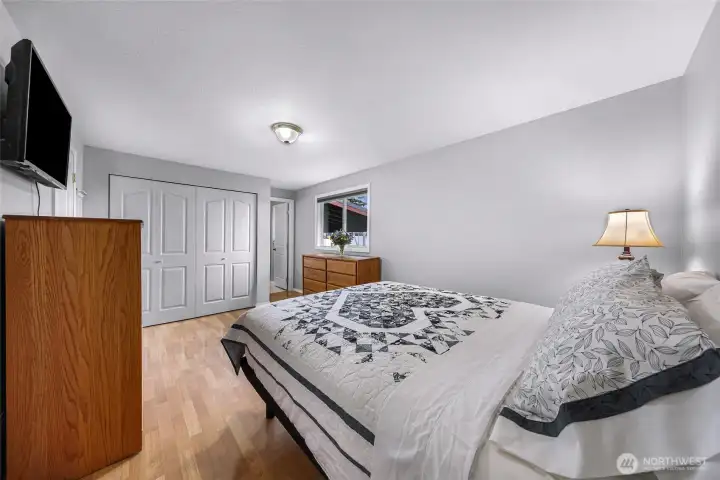 Primary bedroom has 2 large closets and custom pull down black out blinds
