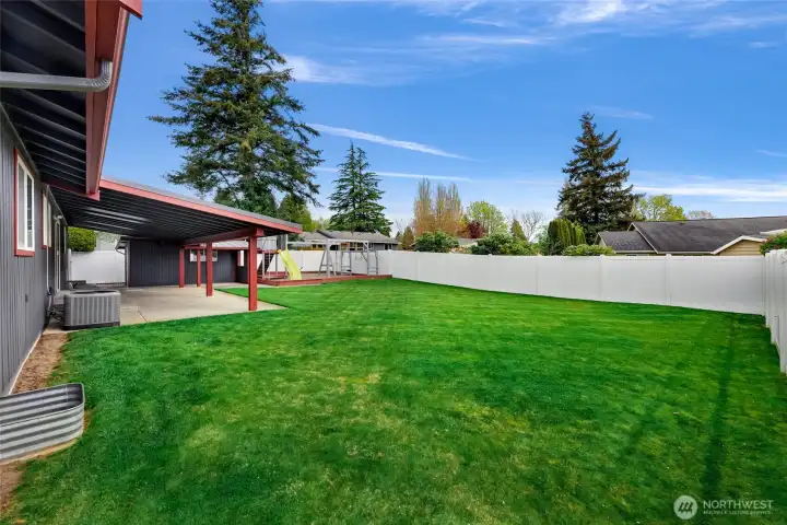 Well maintained and easy care back yard ready for you! New vinyl easy care fencing encases your backyard keeping what you want inside and what you don't, out!