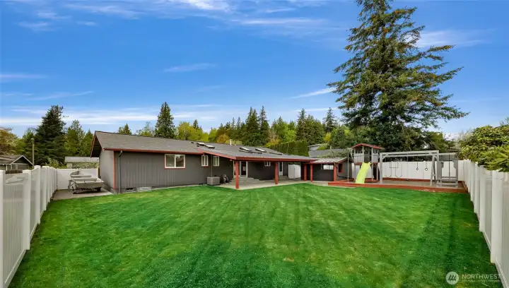 Endless opportunities for this large level sun filled backyard. To the left is the gated RV/boat parking.