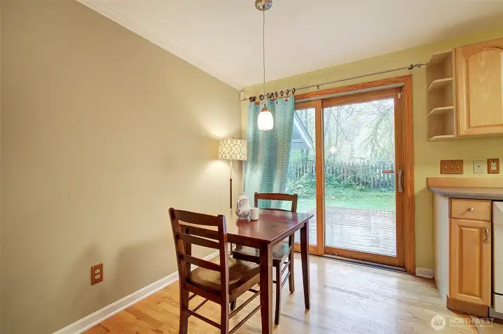 Dining area looks out to the private deck.