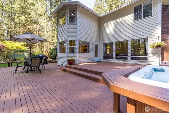 Escape to your own backyard oasis. The multi-level deck offers plenty of space for dining and lounging, while the integrated hot tub provides the ultimate spot to unwind in total privacy.