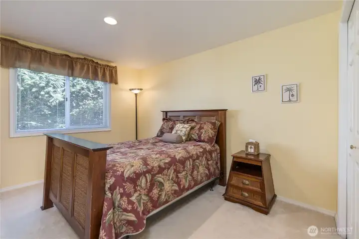 Versatile main-floor bedroom is perfect for a guest suite, quiet home office, or dedicated hobby room.