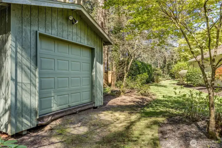 Large garden shed provides excellent storage for all your outdoor equipment, keeping the oversized 3-car garage clear for vehicles and hobbies.