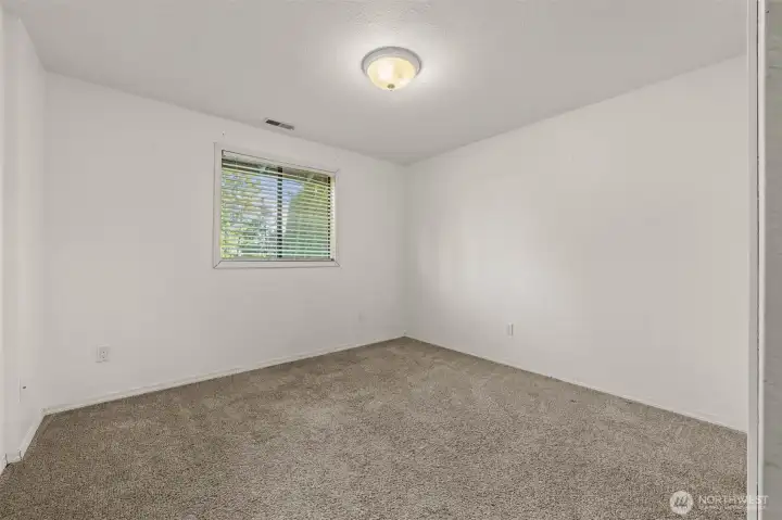 Bedroom 2, off living room, overlooking front yard