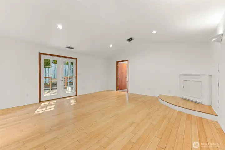 Family room with French doors leading to deck and back yard