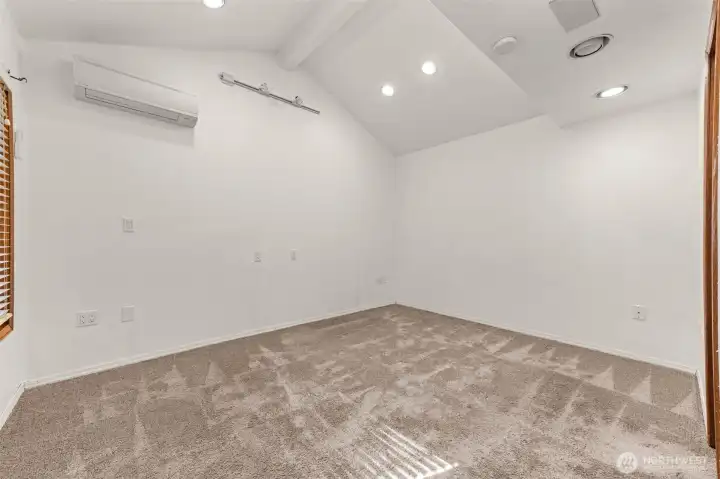 Primary suite with vaulted ceilings and split A/C