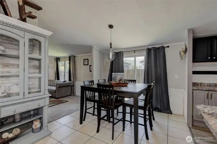 The centrally-located Dining Area features a remodeled hutch (it stays), and can be accessed from the Kitchen, Family Room, Living Room and back Deck!