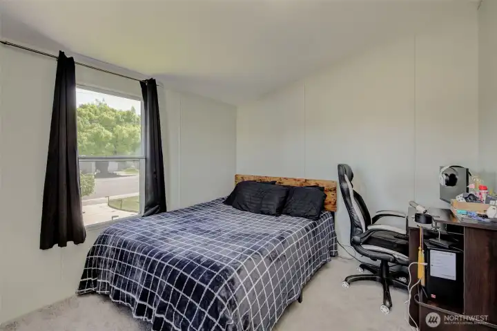 Bedroom 2 is at the opposite end of the home from the Primary Suite