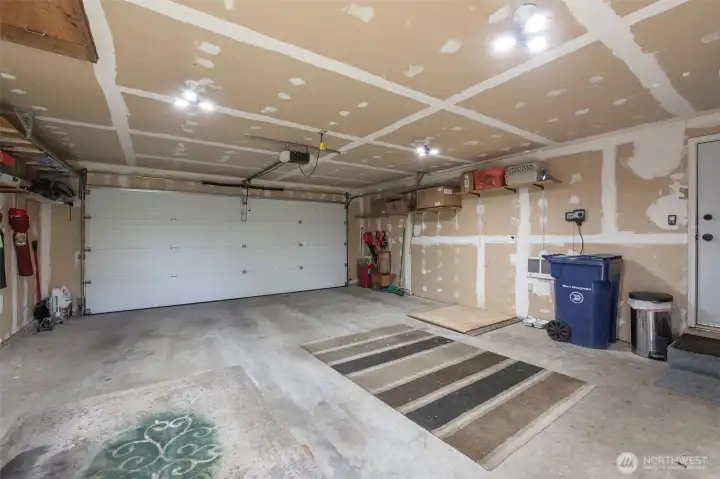 The 2-car Garage has extra space for storage, workshop, etc. And includes a an attic space and a chest freezer!