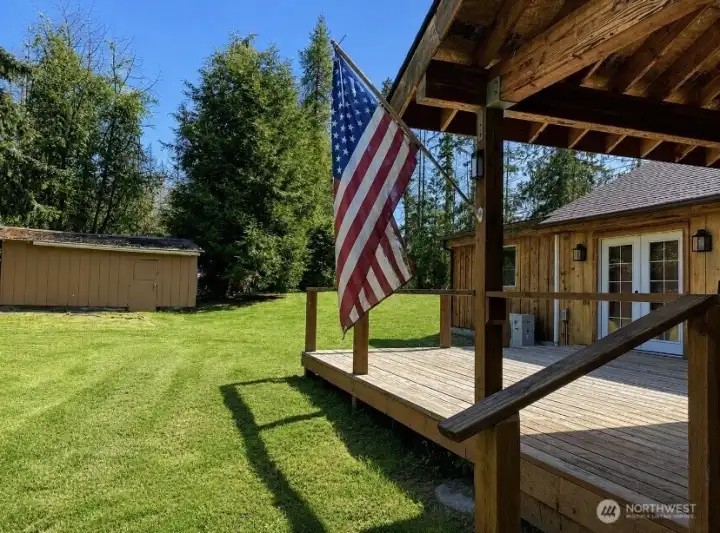 Enjoy outdoor living from the covered porch with easy access to the detached storage building. Enjoy outdoor living from the covered porch with easy access to the detached storage building.