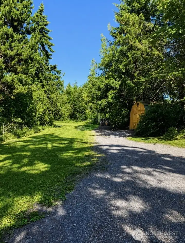 Primary driveway entrance provides convenient access to both the residence and the RV carport. Primary driveway entrance provides convenient access to both the residence and the RV carport.