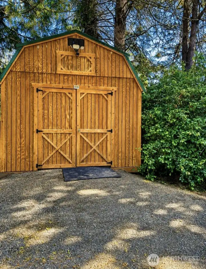 Well-positioned storage shed complements the RV carport and adds valuable storage space. Well-positioned storage shed complements the RV carport and adds valuable storage space.