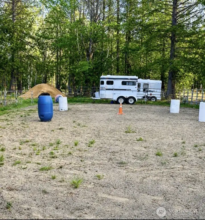 Former riding arena in place, built to shed water for year-round use; fence panels are no longer in place. Former riding arena in place, built to shed water for year-round use; fence panels are no longer in place.
