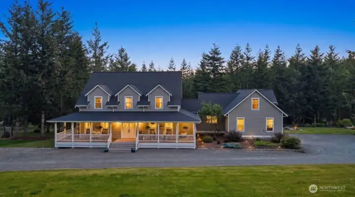 Main home offers approx. 3,780 sq ft with 4 bedrooms, 3 baths, a main-level primary suite, secondary primary suite, bonus room, media room, loft, flex space, workout room, AC, sunroom, oversized deck & more.