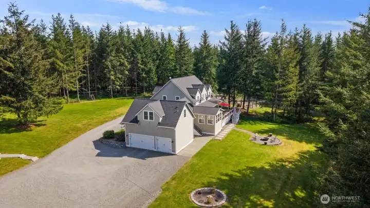Main home features oversized 3 car garage with surprise wine room.