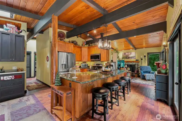 Thoughtfully designed kitchen layout with an expansive breakfast bar and ample workspace. Thoughtfully designed kitchen layout with an expansive breakfast bar and ample workspace.