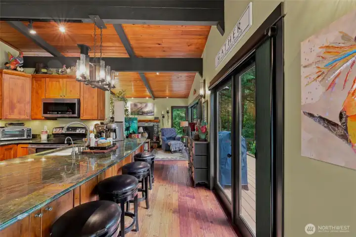 Exceptional craftsmanship shown through the wood plank flooring and custom overhead beams. Exceptional craftsmanship shown through the wood plank flooring and custom overhead beams.