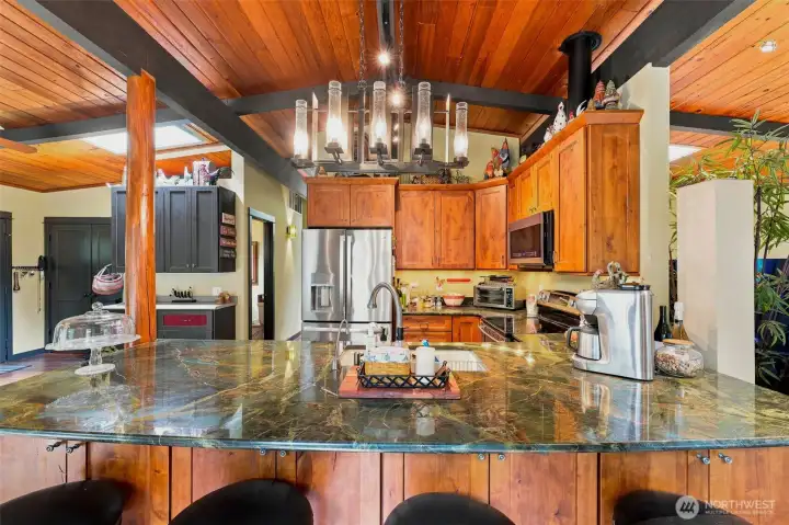 The heart of the home, offering beautiful updates, wood beam ceilings, and open sightlines. The heart of the home, offering beautiful updates, wood beam ceilings, and open sightlines.
