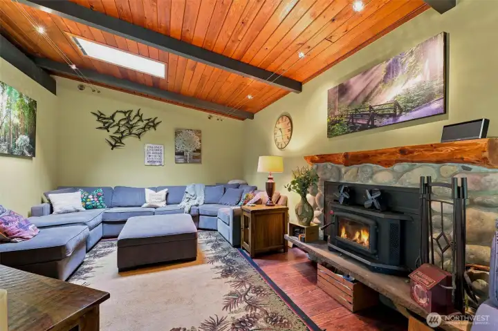 Relax by the wood fireplace in this beautifully updated living space with gorgeous wood plank flooring. Relax by the wood fireplace in this beautifully updated living space with gorgeous wood plank flooring.