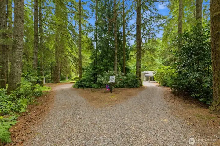 Secure, private gate access leads you down a scenic drive to this established rural lifestyle. Secure, private gate access leads you down a scenic drive to this established rural lifestyle.