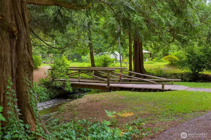 Cross your private bridge over the water to explore your own forest acreage and established trails. Cross your private bridge over the water to explore your own forest acreage and established trails.