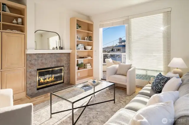 The Living Room has a handsome gas fireplace with bookcases & cabinets flanking it.