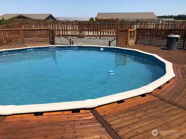Above ground pool with deck.