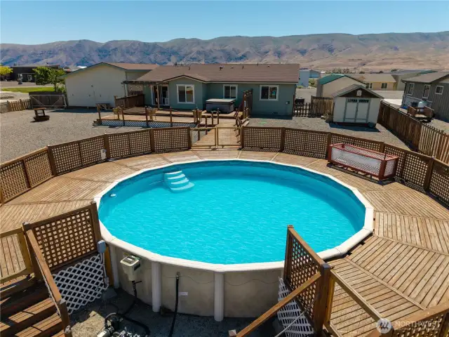 Above ground pool with deck.
