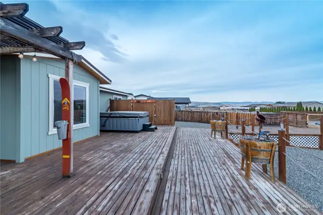 Back deck with hot tub.