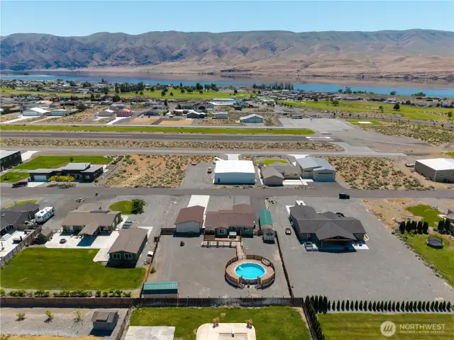 Aerial view of home fully fenced backyard.