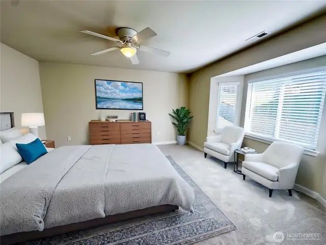 Spacious Primary Bedroom with ceiling fan has many options (virtually staged)