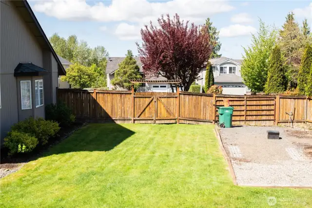 Secure RV parking in the back yard with a wide gate