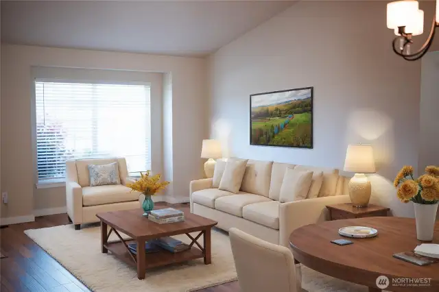 Spacious Living Room opens to Dining and looks out over the lovely Front Yard (virtually staged)
