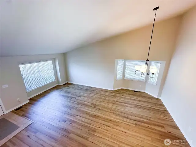 Looking down on the Living & Dining Rooms with high vaulted ceilings