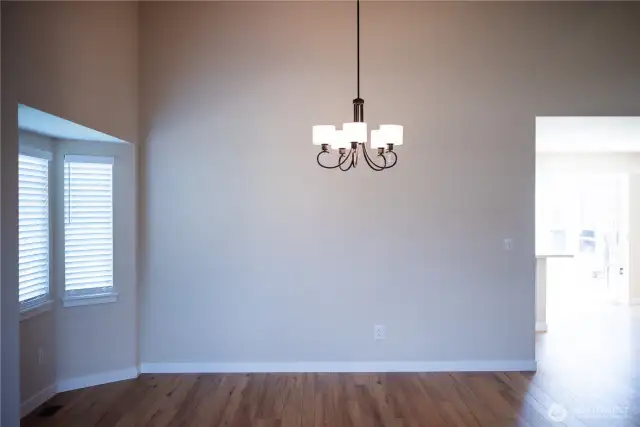Dining Room with bay windows opens to kitchen.