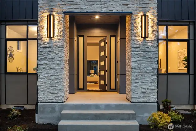 Covered front porch with extensive stonework