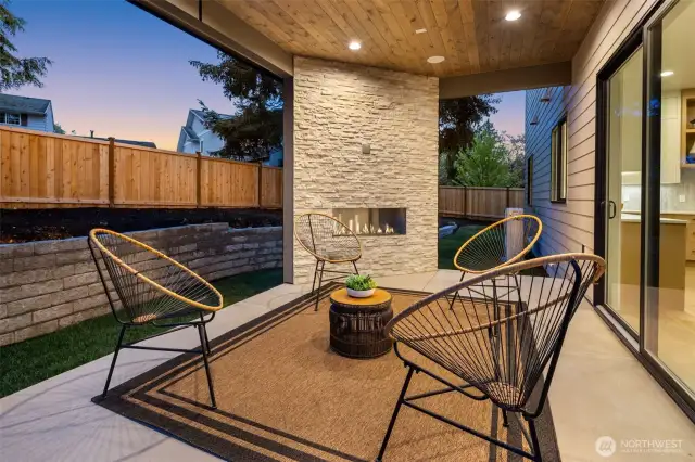 Covered outdoor living with linear gas fireplace, speakers and wiring for electric heaters