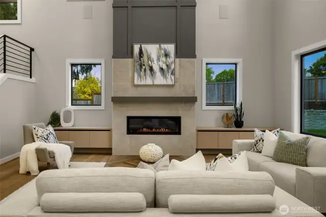 Great room features a modern gas fireplace and buillt in speakers