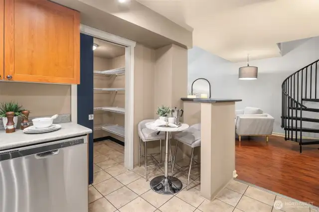 Kitchen with option for breakfast nook and pantry with sliding door.