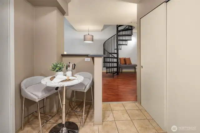 Kitchen opening up and flowing seamlessly into living space.