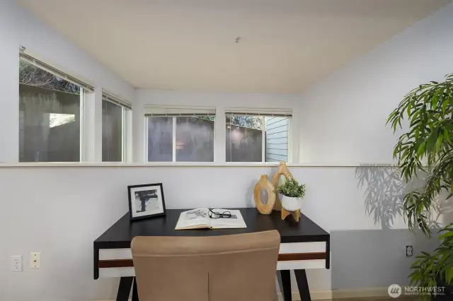 Tall ceilings and wall framed with windows providing an airy flow.