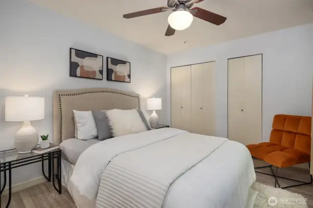 Spacious upper bedroom area with closet space for storage.